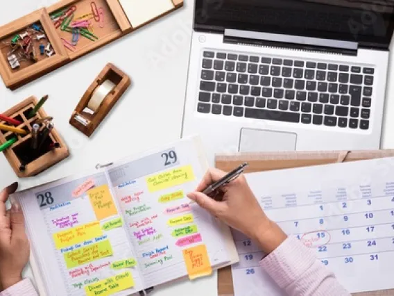 Calendar and planner with computer and other office supplies